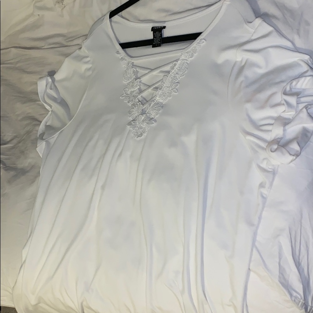 White shirt with lacy detail.